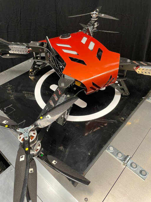 A photo of the Wazp drone docked atop the Atlas autonomous tractor